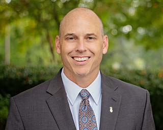 Headshot of Southern First Banker, Adam Cato.