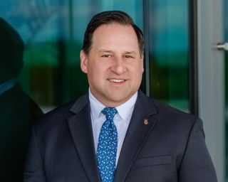 Headshot of Southern First's CFO, Chris Zych.