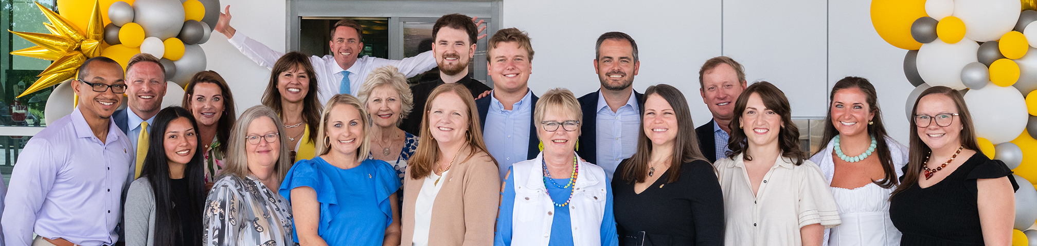 Group of Southern First bankers standing in front of the Verdae Drive Thru.