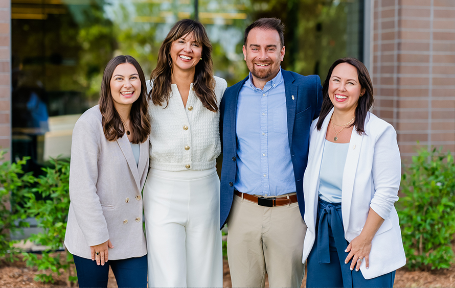 Group photo of the Southern First Human Resources team smiling and laughing.