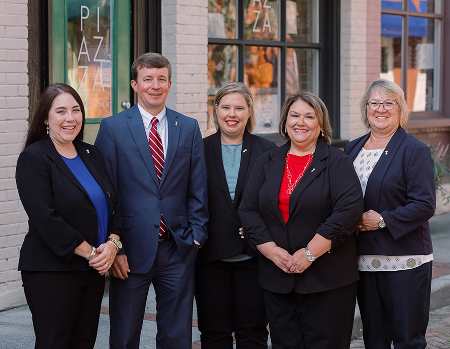 Outdoor group shot of 5 Southern First bankers in a park.