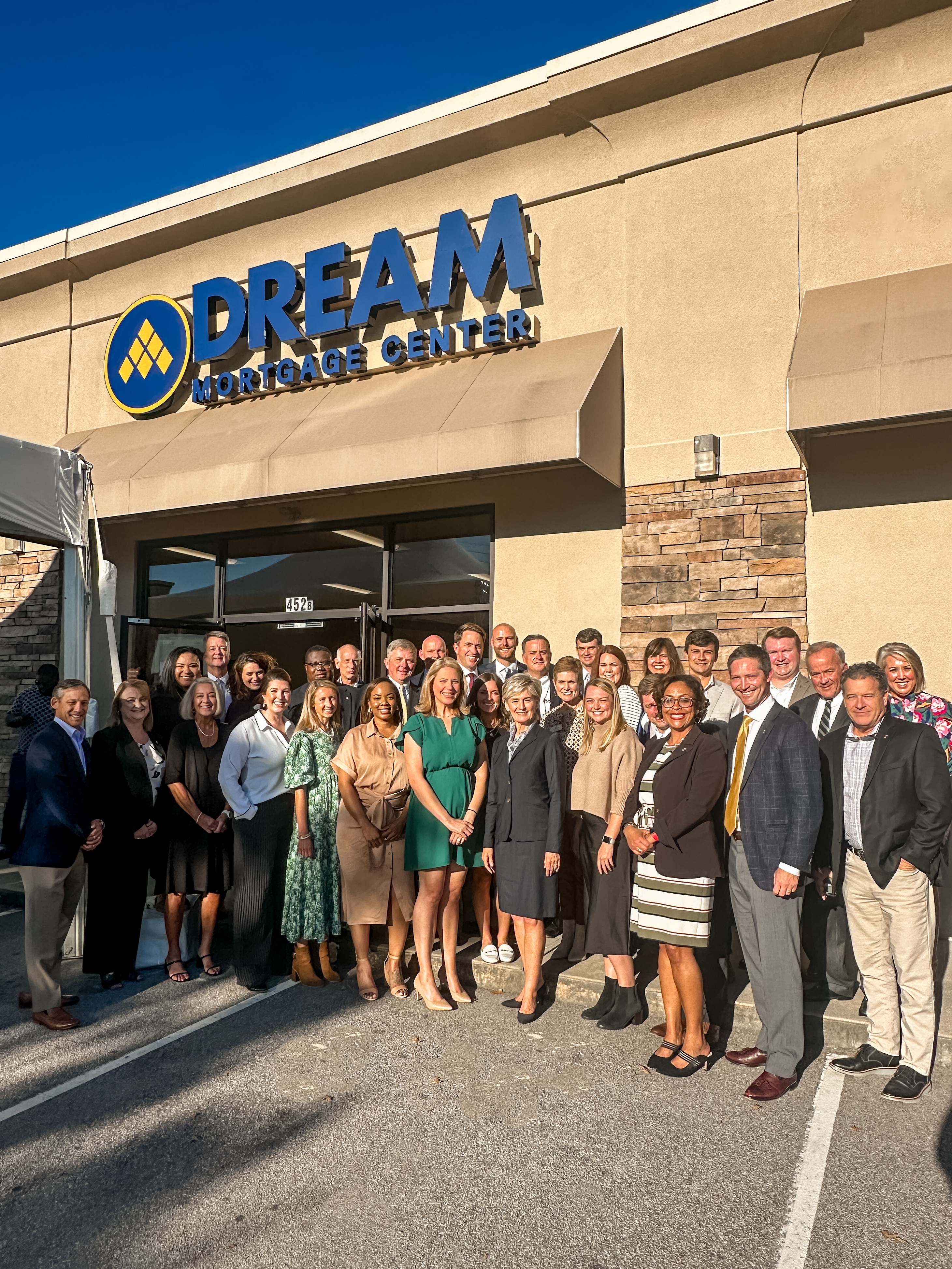 Southern First bankers and mortgage executives in front of the Dream Mortgage Center.