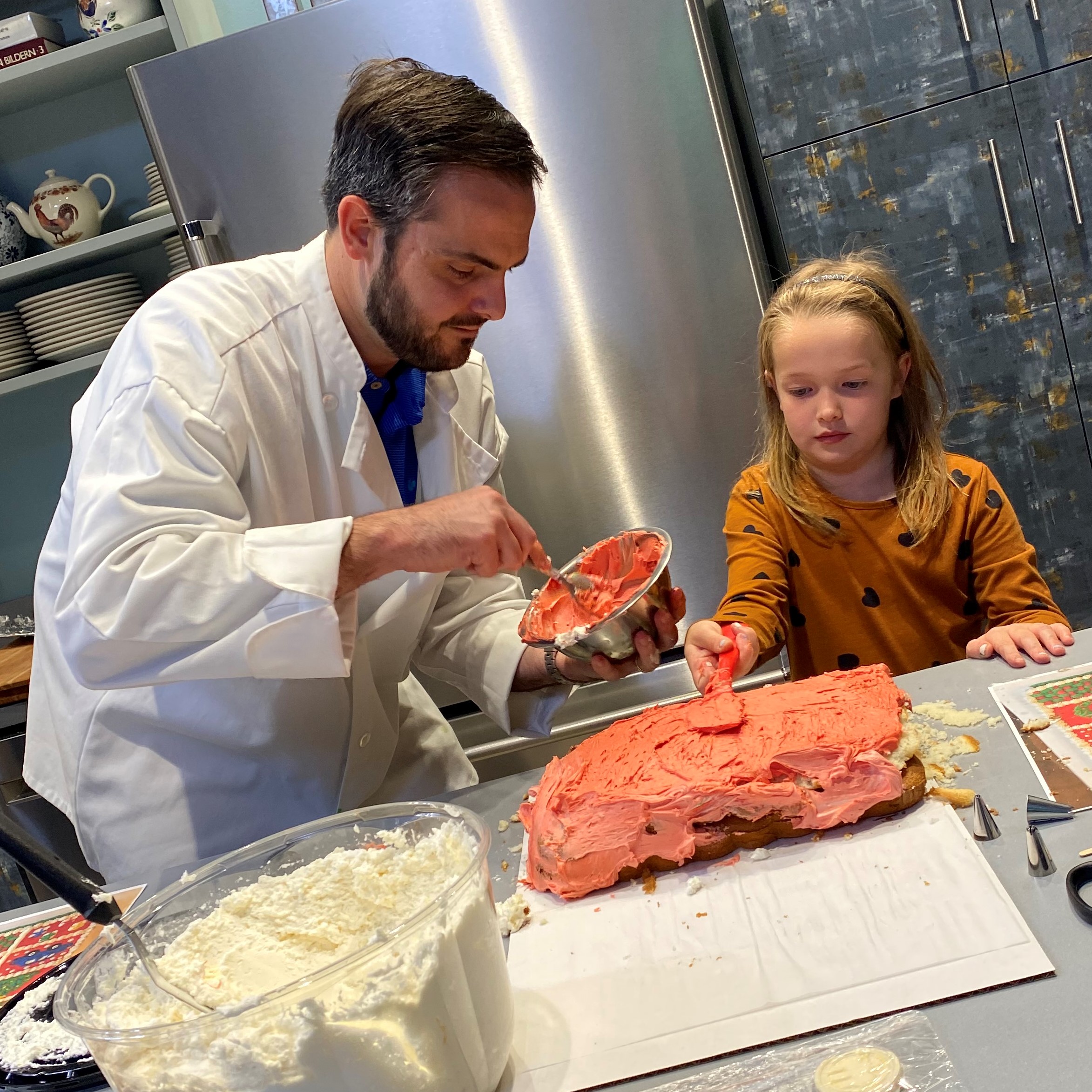 Southern First Banker, William Johnston, and his daughter participating in Meals on Wheels of Greenville's Mealed It! decorating competition.