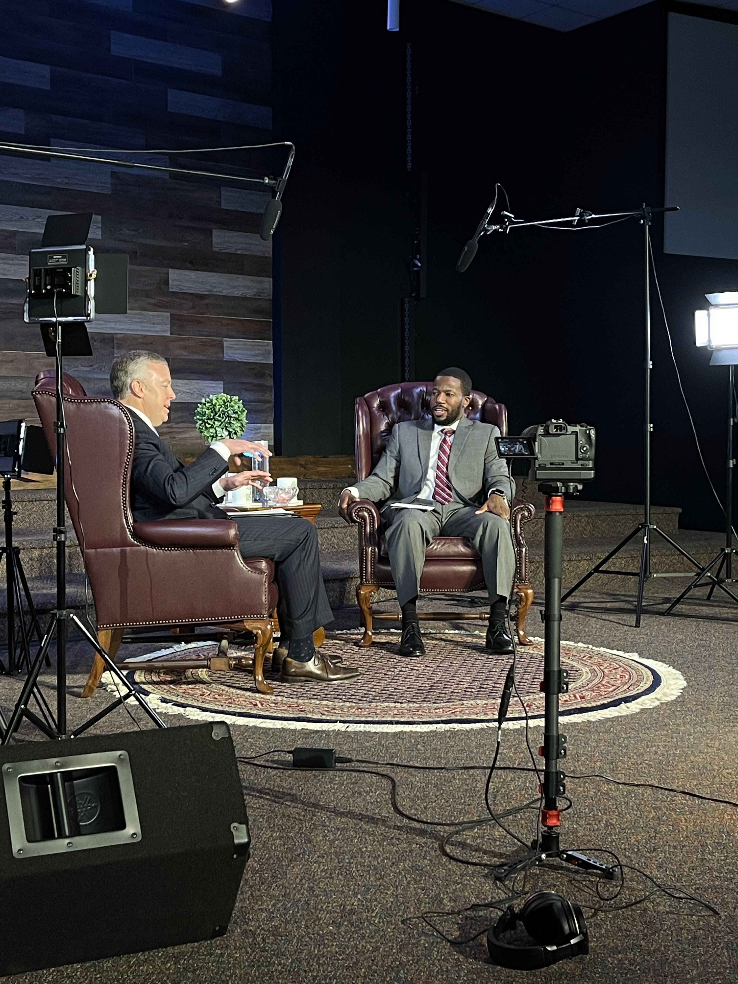 Backstage photo of Mike Dowling and Pastor Akinbinu on set.