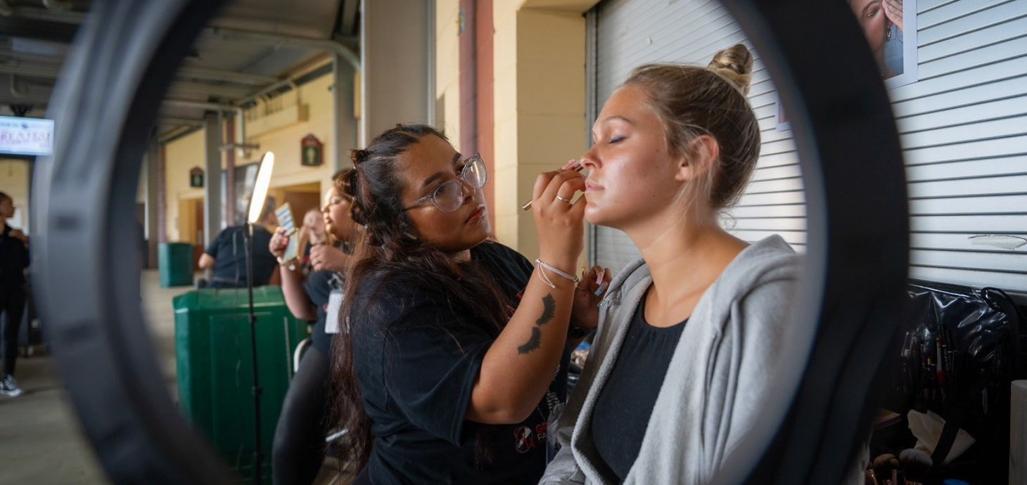 Valentina Gonzales doing makeup on a model.