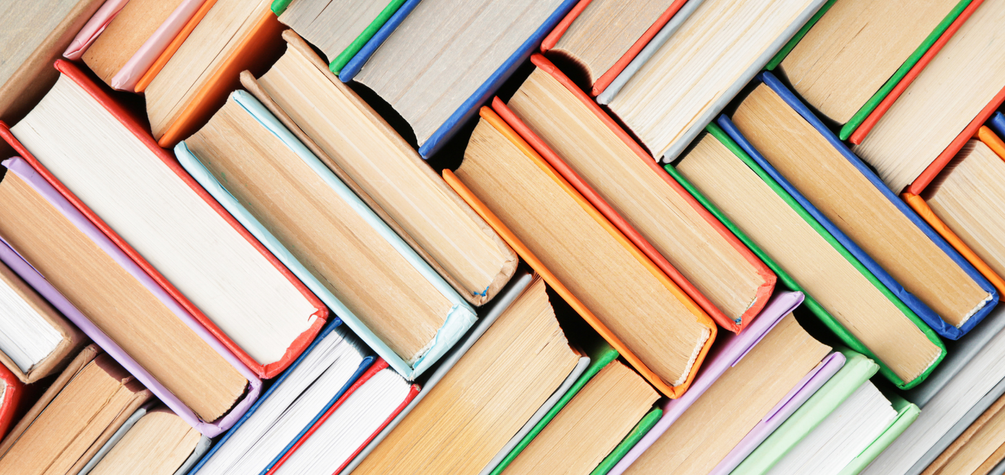 A stack of books with different colored covers.