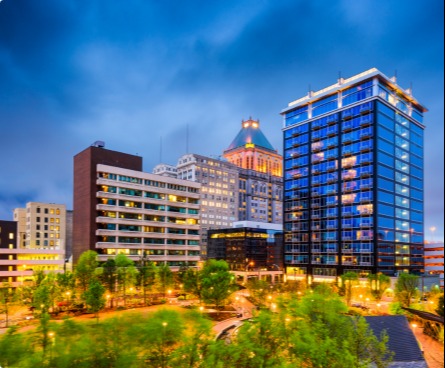 Greensboro city view lit up at night.